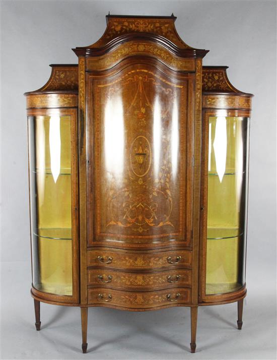 An Edwardian marquetry inlaid bowfronted china display cabinet, in the manner of Edwards & Roberts, H.6ft 6in. W.5ft 4in.